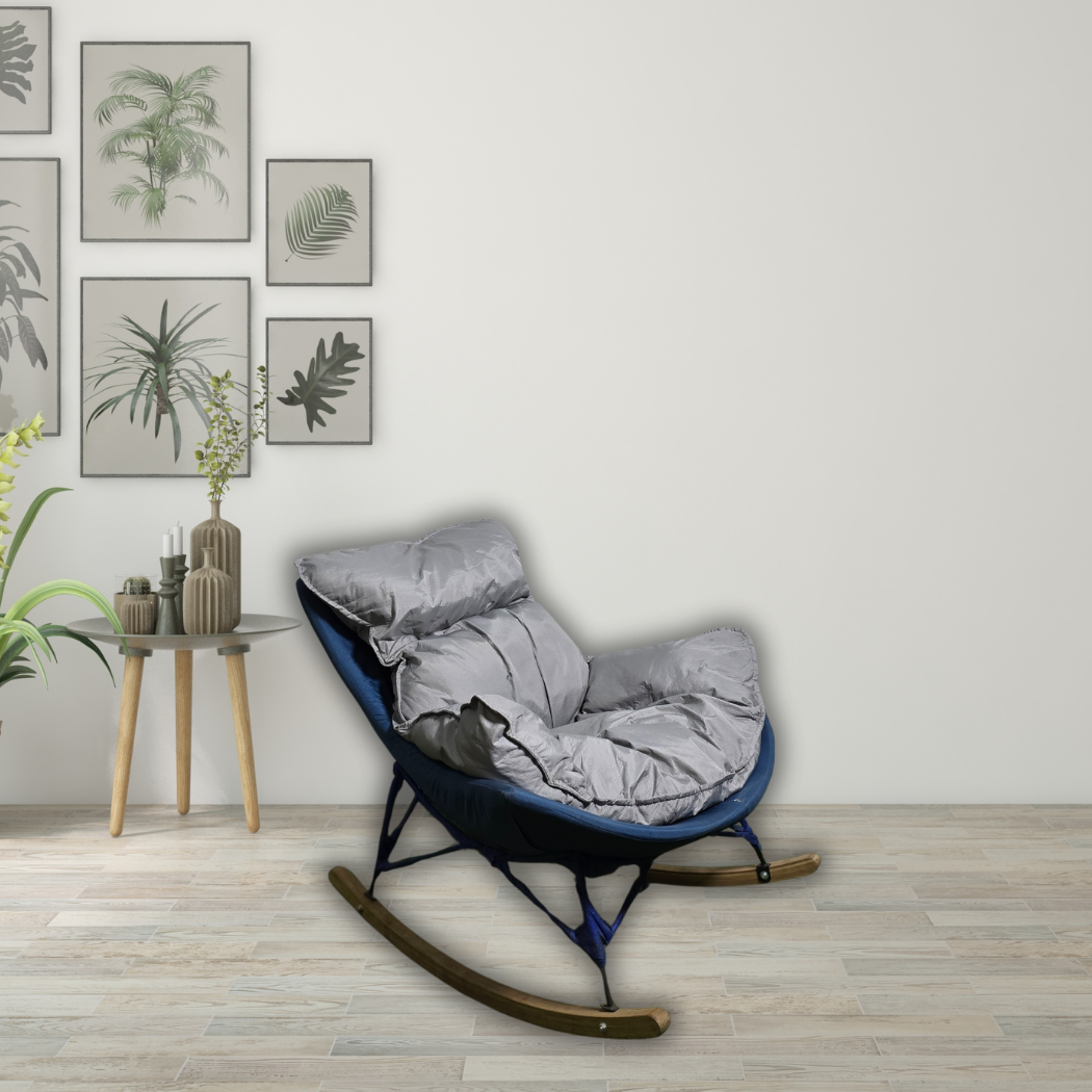 Rocking chair with grey detachable cushion on top, dark blue base with black bars and brown curved wood
