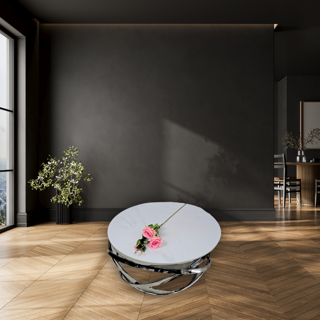 Round, white marble top with silver ring pattern at the bottom