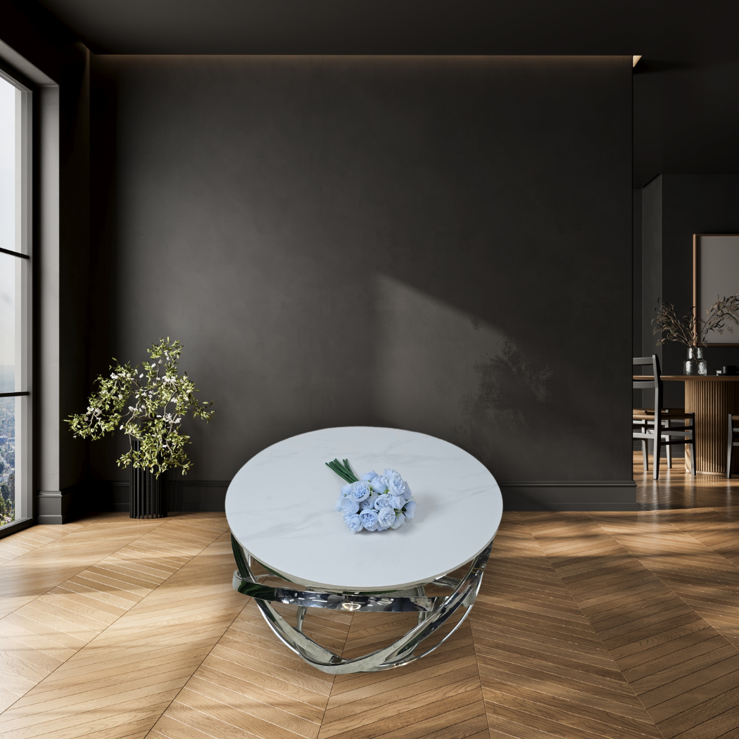 Round, small, white marble top with silver ring pattern at the bottom