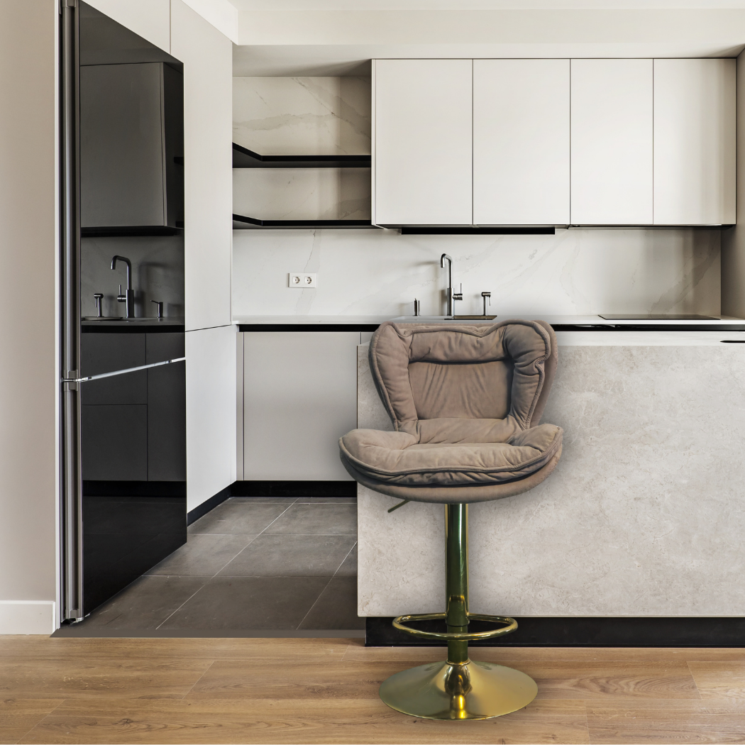 Light brown cushion top with light brown base, hight adjustable with gold pole leg, circle base and foot rest