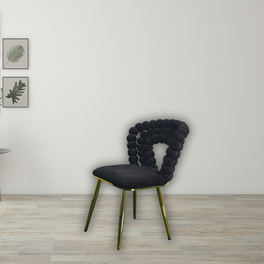 Black top with round ball pattern and gold square bottom platform, bar stool with gold legs and a square gold ring between legs