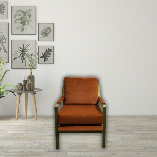 Burnt orange sofa chair with gold armrest and legs