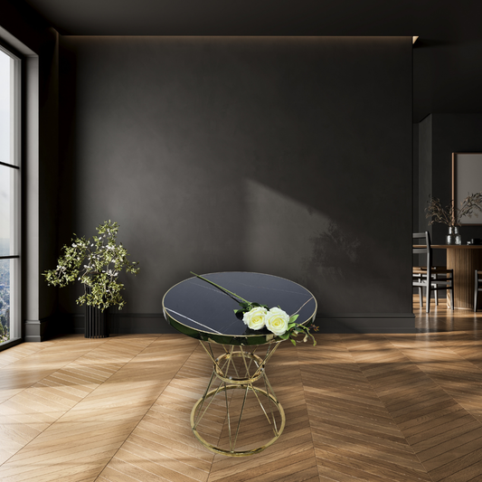 Round. black marble table with gold frame & base
