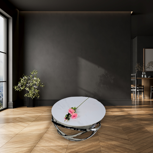 Round, white marble top with silver ring pattern at the bottom