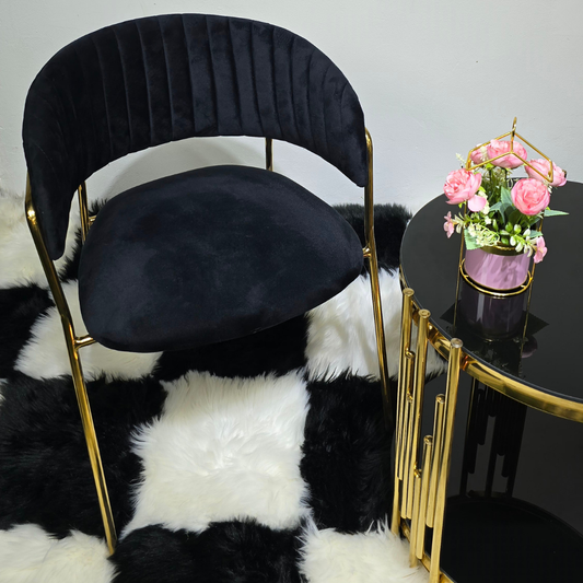 black with C-shaped top with back rest and gold legs